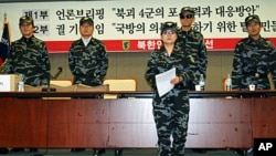 Members of the NKPLF reading petition before submitting it to the S Korean Defense Ministry