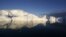 Icebergs are reflected in the calm waters at the mouth of the Jakobshavn ice fjord near Ilulissat in Greenland. (file photo)