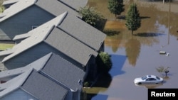 Flooding waters of theTar River cover the Riverwalk Apartments due to rainfall caused from Hurricane Matthew in Greenville, North Carolina, U.S., October 11, 2016. 