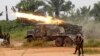 FILE - Democratic Republic of Congo soldiers launch missiles during a military operation against ADF rebels outside the town of Beni, in North Kivu province, Jan. 18, 2014.