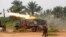 FILE - Democratic Republic of Congo soldiers launch missiles during a military operation against ADF rebels outside the town of Beni, in North Kivu province, Jan. 18, 2014.
