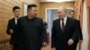 North Korean leader Kim Jong Un walks with Russian President Vladimir Putin shortly after Putin's arrival in Pyongyang, early on June 19, 2024.