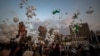 People release scores of white balloons bearing the names of the Aug. 4 blast victims at about 6:07 p.m., when the deadly explosion occurred, to mark the two-month anniversary, next to the seaport of Beirut, Lebanon, Sunday, Oct. 4, 2020. 