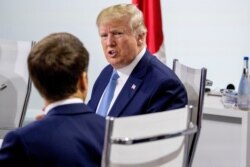 French President Emmanuel Macron and President Donald Trump participate in a G-7 Working Session on the Global Economy, Foreign Policy, and Security Affairs the G-7 summit in Biarritz, France August 25, 2019.