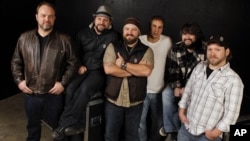 The Zac Brown Band, from left, John Driskell Hopkins, Coy Bowles, Zac Brown, Jimmy De Martini, Clay Cook, and Chris Fryar are shown in Nashville, Tennessee, Dec. 29, 2010. 