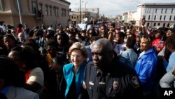 Democratic presidential candidate Sen. Elizabeth Warren prepares to walk across the Edmund Pettus Bridge in Selma, Ala., March 1, 2020, to commemorate the 55th anniversary of "Bloody Sunday," when white police attacked black marchers in Selma. 