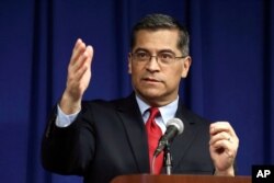 FILE - California Attorney General Xavier Becerra speaks during a news conference in Sacramento, California, March 5, 2019.
