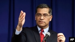 FILE - California Attorney General Xavier Becerra speaks during a news conference in Sacramento, California, March 5, 2019.