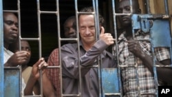 David Cecil, British producer of a play concerning the condition of Uganda's gays, in a courtroom cell, Kampala, Sept. 13, 2012.