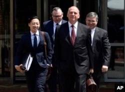 Thomas Zehnle (2nd-R), attorney for Paul Manafort, President Donald Trump's former campaign chairman, walks with other members of the defense team to Alexandria Federal Courthouse in Alexandria, Va., Aug. 6, 2018.