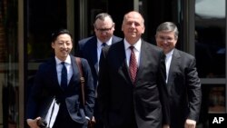 Thomas Zehnle (2nd-R), attorney for Paul Manafort, President Donald Trump's former campaign chairman, walks with other members of the defense team to Alexandria Federal Courthouse in Alexandria, Va., Aug. 6, 2018.
