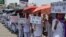 Schoolgirls holding placards participate in a protest rally against the rape of two teenage girls in Chatra and Pakur districts of eastern state of Jharkhand, in Ranchi, India, May 8, 2018.