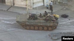 A Syrian army tank is seen in the Zabadani neighborhood of Damascus. (file photo)