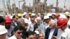 FILE - In this photo released by the office of the Iranian president on April 30, 2017, then-President Hassan Rouhani, center, inaugurates a new refinery in Bandar Abbas, Iran. Global oil prices might hinge on Israel's military response to Iran's Oct. 1, 2024, missile attacks.