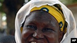 Diawara Aissata displays her newly-acquired national identity card and voter ID in the Plateau neighborhood of Abidjan, Ivory Coast (File)