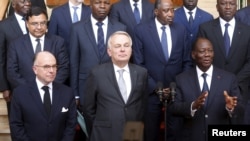 French Interior Minister Bernard Cazeneuve (L), French Foreign Minister Jean-Marc Ayrault (C) and Ivory Coast President Alassane Ouattara (R) are seen during a press conference at presidential palace in Abidjan, Ivory Coast, March 15, 2016. 
