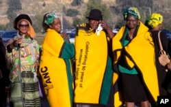 Mourners gather near Soweto's Orlando stadium for the funeral service of anti-apartheid icon Winnie Madikizela-Mandela in Soweto, South Africa, April 14, 2018.