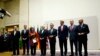 EU foreign policy chief Catherine Ashton, third from left, delivers statement during ceremony marking deal between Iran, six world powers, United Nations, Geneva, Nov. 23, 2013.