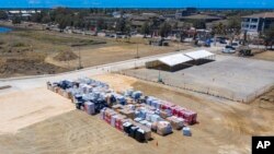 FILE - Aid supplies are stacked at the port at Nuku'alofa, Tonga, Jan. 27, 2022, in this photo provided by the Australian Defence Force.