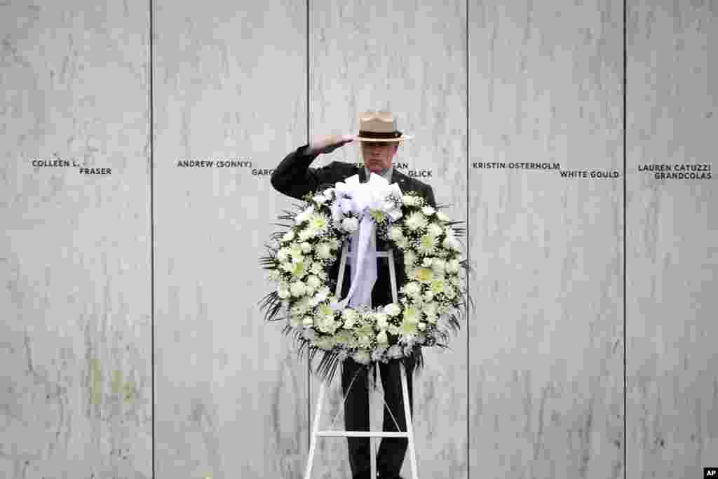 A National Park Service ranger rehearses the wreath laying ceremony that President Donald Trump will participate in during a memorial service at the Wall of Names at the Flight 93 National Memorial in Shanksville, Pa., Friday, Sept. 11, 2020.(AP Photo/Gene J. Puskar)