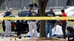 Police shot and killed two gunmen after they opened fire on a security officer outside Curtis Culwell Center in Garland, Texas, Monday, May 4, 2015. The center was hosting a contest for Prophet Muhammad cartoons. (AP Photo/Brandon Wade)
