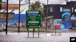 A flooded road is seen in the northern New South Wales town of Lismore, Australia, March 9, 2025. (Jason O'Brien/AAP Image via AP)