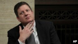 Chicago police Officer Jason Van Dyke listens while attorneys step before Judge Vincent Gaughan bench, as the jury has sent another question to Judge Gaughan, who read it aloud from the bench during deliberations in Van Dyke's trial at the Leighton Criminal Court Building in Chicago, Oct. 5, 2018.