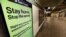 A message is seen on an electronic display inside a mostly empty 42nd Street subway station during the coronavirus outbreak in New York City, March 20, 2020. 