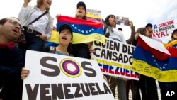 FILE - Demonstrators who are against the Venezuelan government chant outside of the Organization of American States during the special meeting of the Permanent Council, in Washington, April 3, 2017, to consider the recent events in Venezuela.