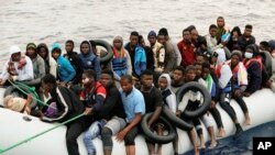 Illegal migrants are brought to shore after being intercepted by the Libyan coast guard on the Mediterranean Sea, in Garaboli Libya. Taken Mon. Oct. 18, 2021.