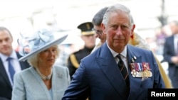 Britain's Prince Charles and his wife Camilla, Duchess of Cornwall arrive at Westminster Abbey in central London May 10, 2015. 