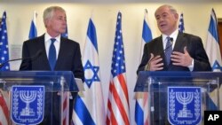 Israeli Prime Minister Benjamin Netanyahu (R) speaks as U.S. Defense Secretary Chuck Hagel listens during a joint press conference at the prime minister's office, May 16, 2014, in Jerusalem.