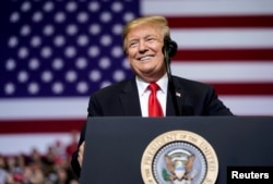 FILE - U.S. President Donald Trump speaks during a rally in Grand Rapids, Michigan, March 28, 2019.
