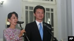 Burma’s pro-democracy leader Aung San Suu Kyi after meeting with Japan's Foreign Minister Koichiro Gemba, one of many recent high-profile visitors, in Rangoon, Dec. 26, 2011.