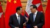 Cambodian Prime Minister Hun Sen chats with Chinese Premier Li Keqiang during a signing ceremony at the Great Hall of the People in Beijing, China, January 22, 2019. (Photo from REUTERS)