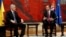 Serbian President Aleksandar Vucic, right, speaks with Chairman of Bosnian tripartite Presidency Dragan Covic in Belgrade, Serbia, Dec. 6, 2017. 