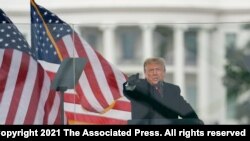 FILE - Then-President Donald Trump speaks at a rally in Washington, Jan. 6, 2021.