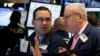 Traders work on the floor of the New York Stock Exchange in New York, Feb. 7, 2017.