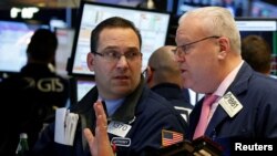 Traders work on the floor of the New York Stock Exchange in New York, Feb. 7, 2017.