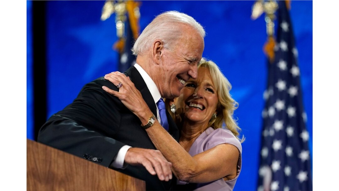 FILE - Democratic presidential candidate Joe Biden hugs his wife, Jill Biden, after his speech during the fourth day of the Democratic National Convention, Aug. 20, 2020, at the Chase Center in Wilmington, Del.