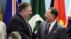 FILE - U.S. Secretary of State Mike Pompeo, left, greets North Korea's Foreign Minister Ri Yong Ho at the 25th ASEAN Regional Forum Retreat in Singapore, Aug. 4, 2018. President Donald Trump on Aug. 24 called off a visit to North Korea by Pompeo because of what the president felt was a lack of progress in denuclearization talks.