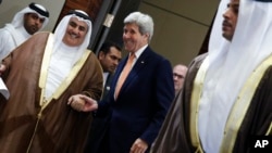 Bahrain's Foreign Minister Sheikh Khalid bin Ahmed al-Khalifa and Secretary of State John Kerry arrive to speak to reporters ahead of the Gulf Cooperation Council (GCC) Ministerial meeting in Manama, Bahrain, April 7, 2016.