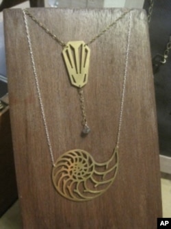 Katie Miller's sheet metal jewelry designs