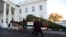 First lady Melania Trump and her son Barron Trump, look at the Wisconsin-grown Christmas tree at the North Portico of the White House in Washington, Nov. 20, 2017. The tree will be displayed in the White House Blue Room.