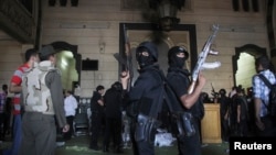 Policemen stand guard inside a room of the al-Fath mosque when supporters of deposed Egyptian President Mohamed Morsi exchanged gunfire with security forces inside the mosque in Cairo, Aug.t 17, 2013