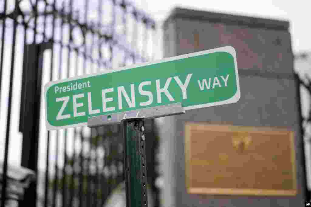 A sign that reads &quot;President ZELENSKY WAY&quot; is seen in front of the Embassy of Russian Federation in Washington.