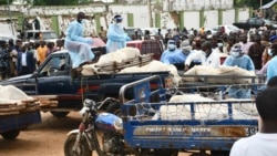 Bodies of people killed by suspected Boko Haram Islamist extremists are transported for burial, in Tarmuwa, northeast Nigeria, Sept. 3, 2024. 