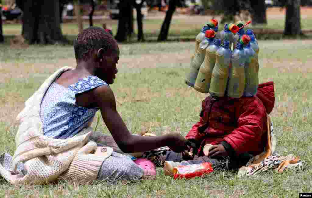 A child wears plastic bottle waste provided by climate change and environmental activists as they protest marking a global climate action day under the theme &#39;&#39;#AfricaIsNotADumpster&#39;&#39; at the Uhuru Park&#39;s Freedom Corner in Nairobi, Kenya.
