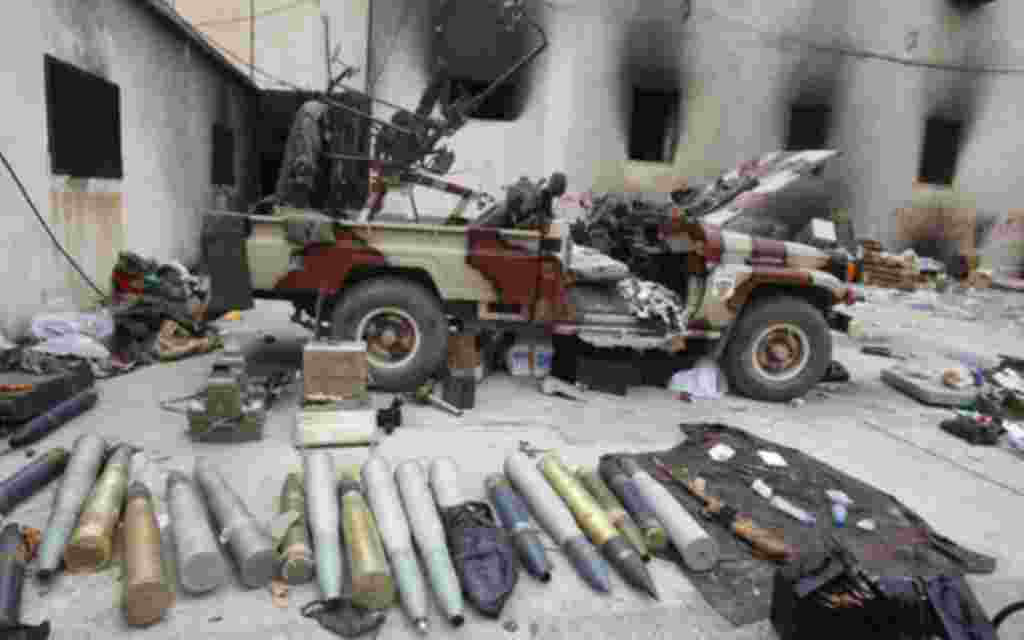 Munitions lie in a state security building taken over by anti-government protesters in Ben Ghazi February 23, 2011. People in Benghazi said earlier they now felt safe enough to start handing in weapons recovered after security forces lost control of the L
