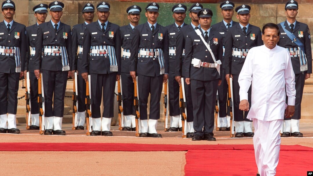 Sri Lanka’s President Maithripala Sirisena inspects a guard of honor during a ceremonial reception at the Indian Presidential Palace in New Delhi, India, Feb. 16, 2015. 